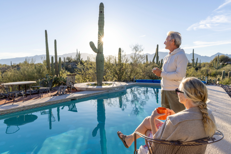 senior couple on Arizona with outdoor pool